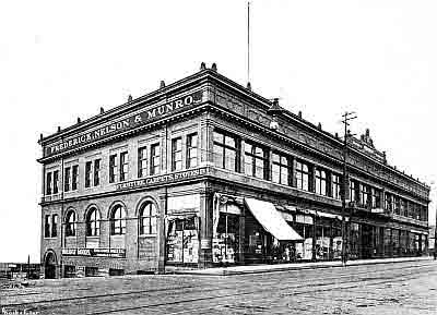 Block-long two-story commerical building; Frederick, Nelson, and Monro major tenant.